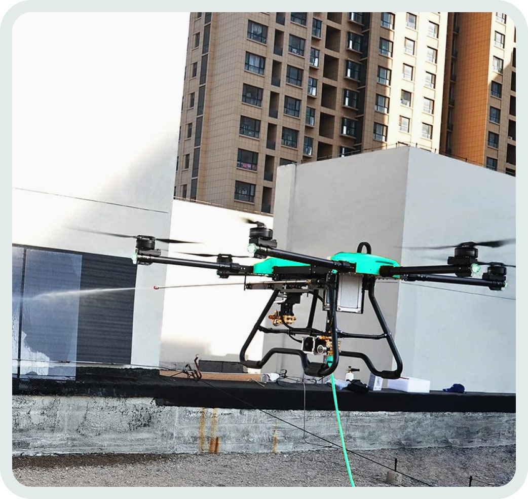 Drone window cleaning on commercial building